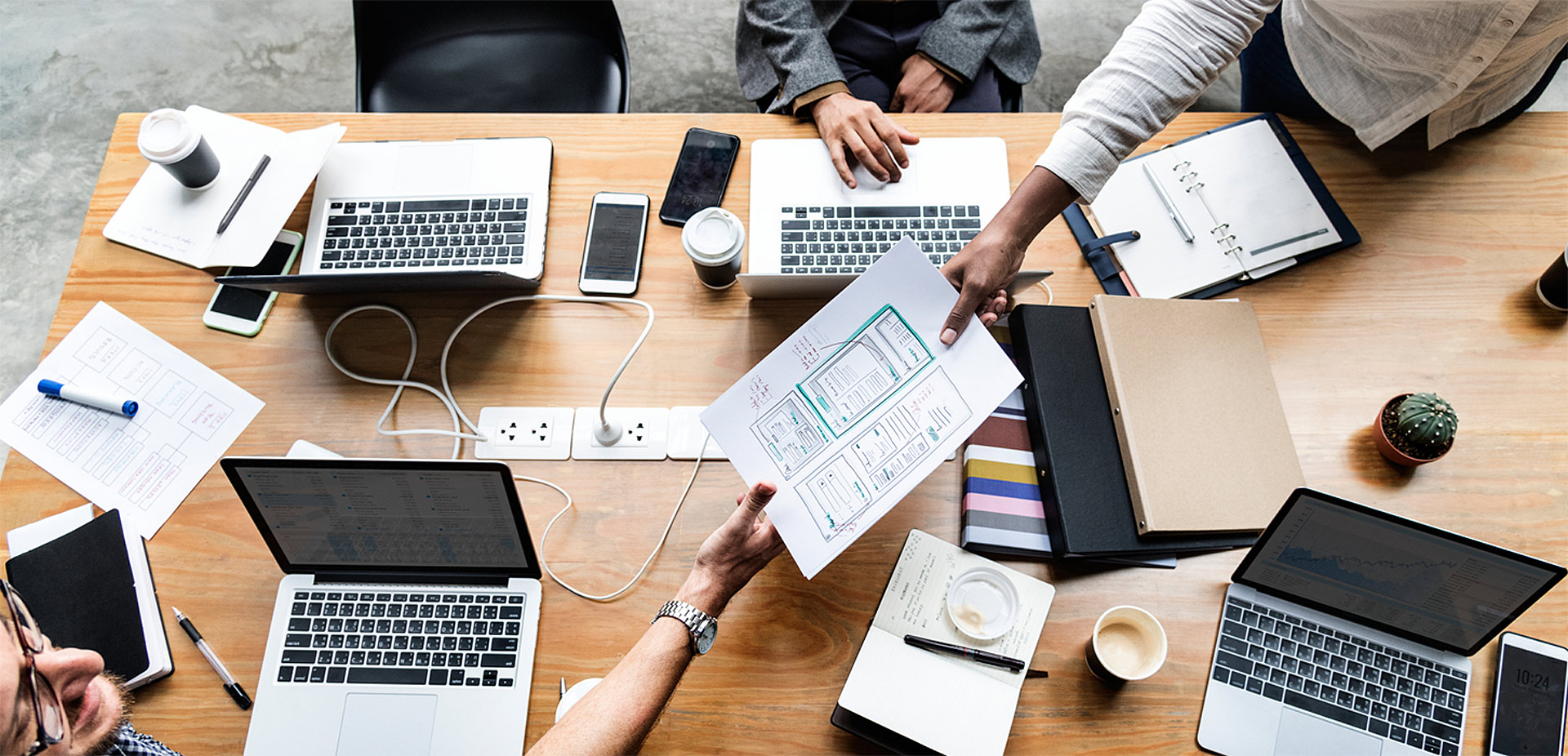 Desk with designers trading information